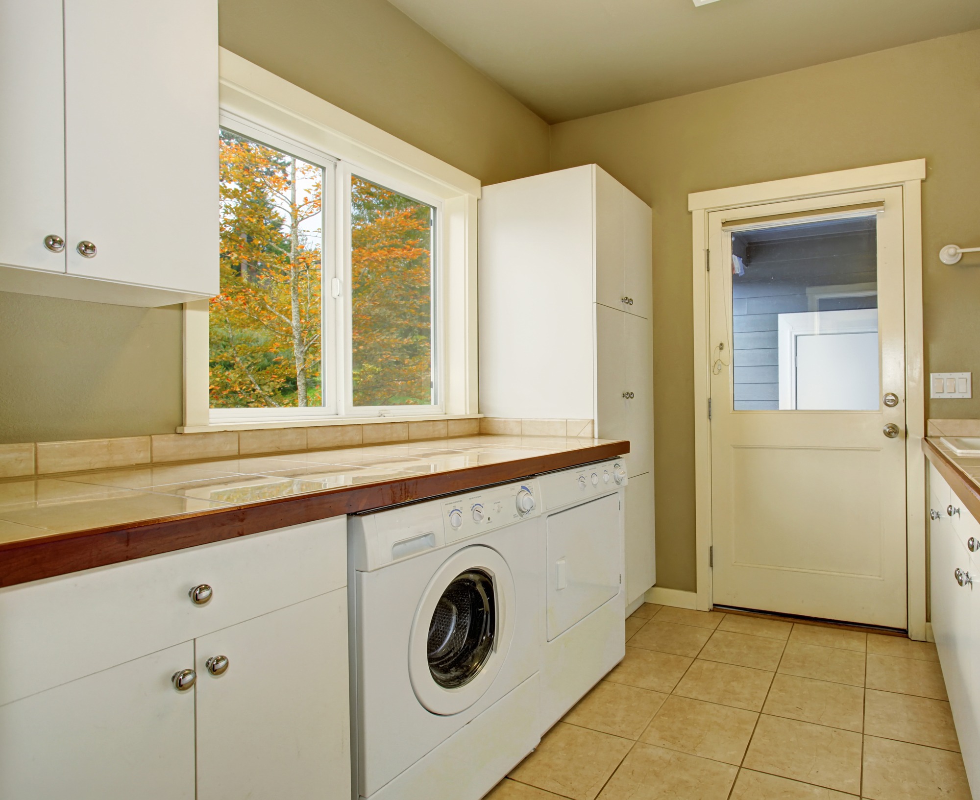 Clean laundry room in rental home by Airbnb cleaning service in Naples, FL.